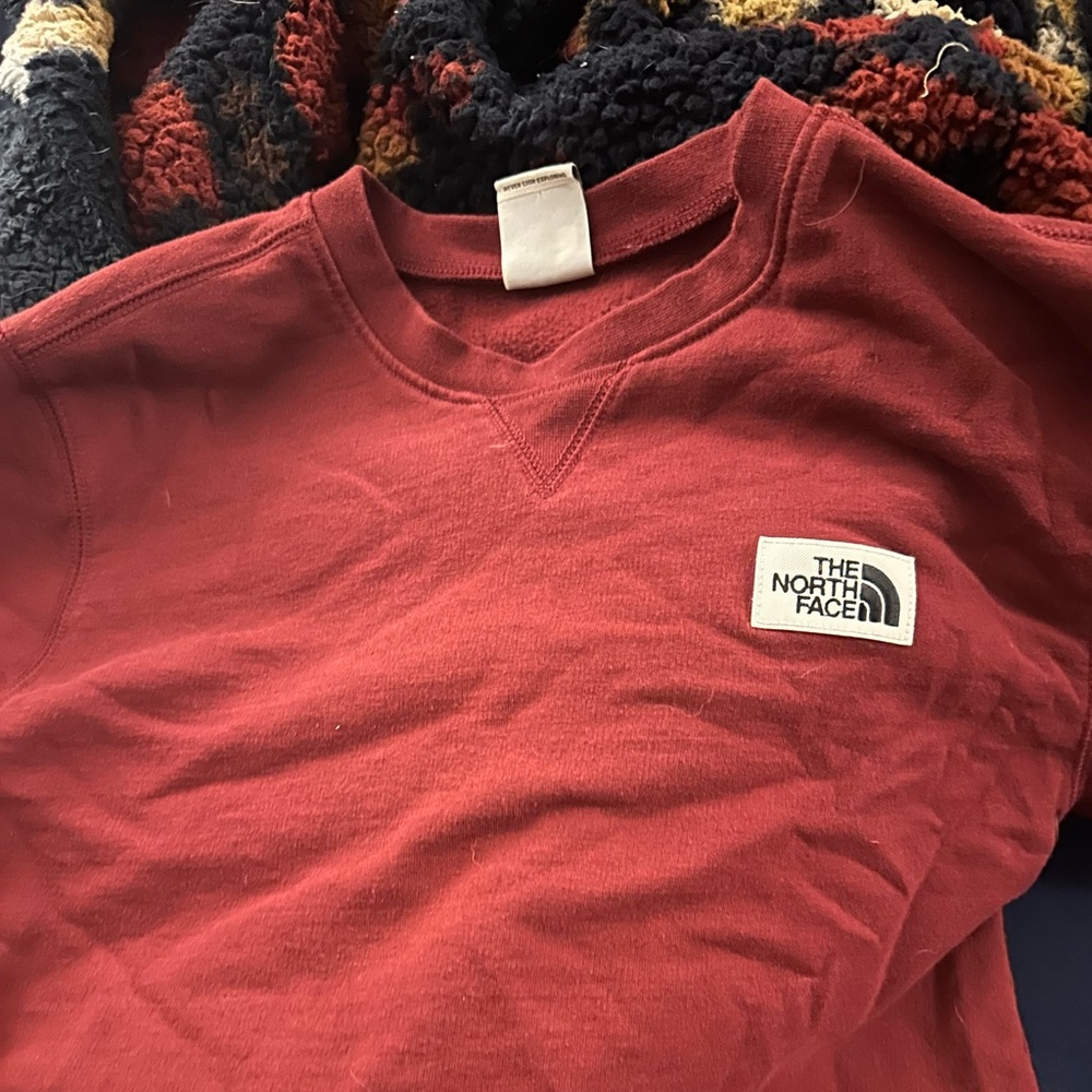 Red men’s north face sweatshirt size small